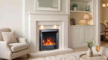 Living room with white fireplace surround and beige sofa, showcasing the black nickel electric fire with glowing logs for cozy decor