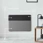 Wall mounted grey convector heater showing energy saving and thermostat features
