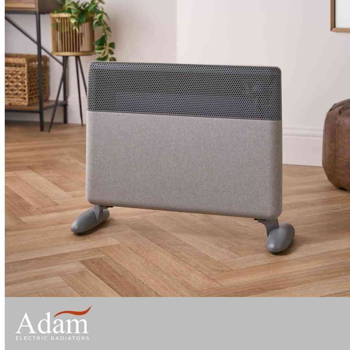 Freestanding grey fabric electric radiator on wooden floor with logo