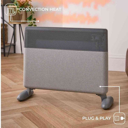 Freestanding grey convection heater with plug and play icon and heat feature