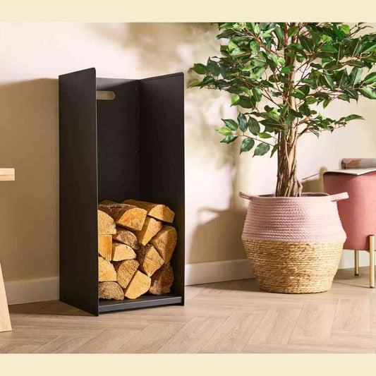 Black freestanding indoor log rack holding chopped wood beside home decor