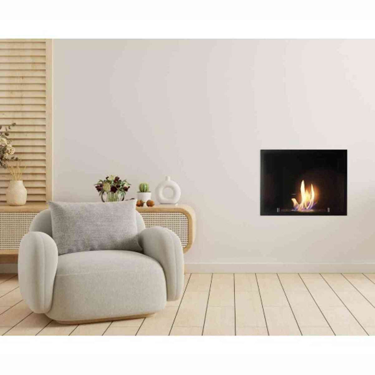 Black bioethanol inset fire mounted on living room wall beside armchair with active flame