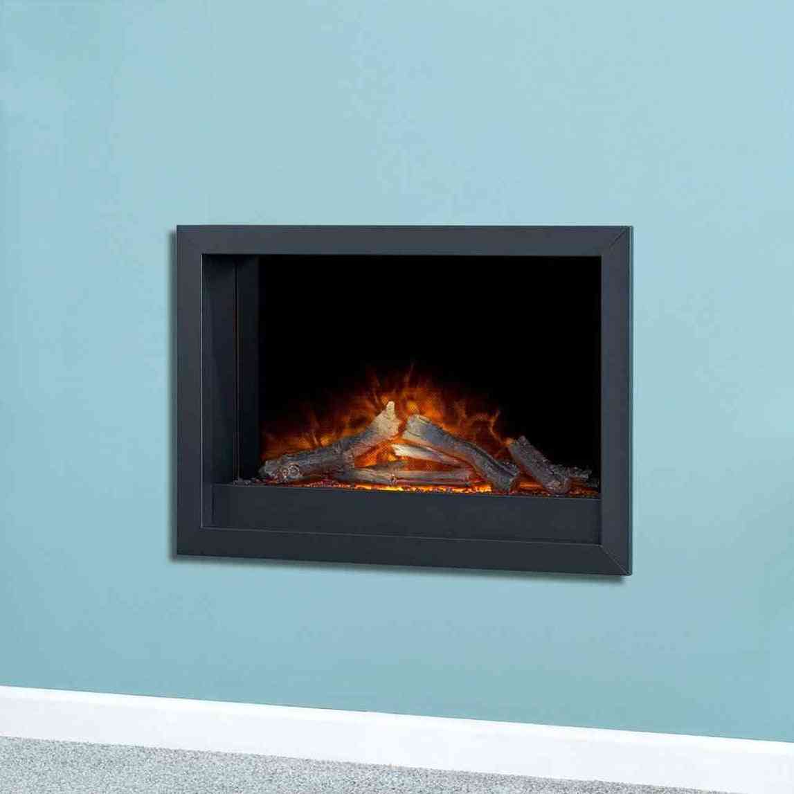 Black inset electric fire installed flush in blue wall with glowing LED flames