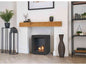 Modern black bio ethanol stove with a sleek square design and visible flames, placed in a stylish living room with decorative items
