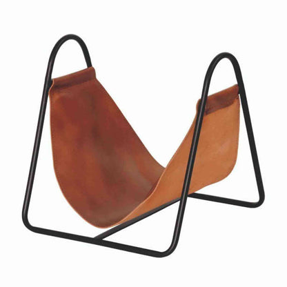 Empty Apache brown leather log holder basket with black metal arches on white background
