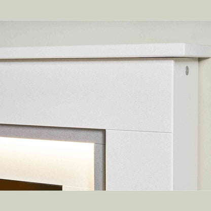Detail shot of white speckled mantel and integrated warm white LED ambient light strip on fireplace suite