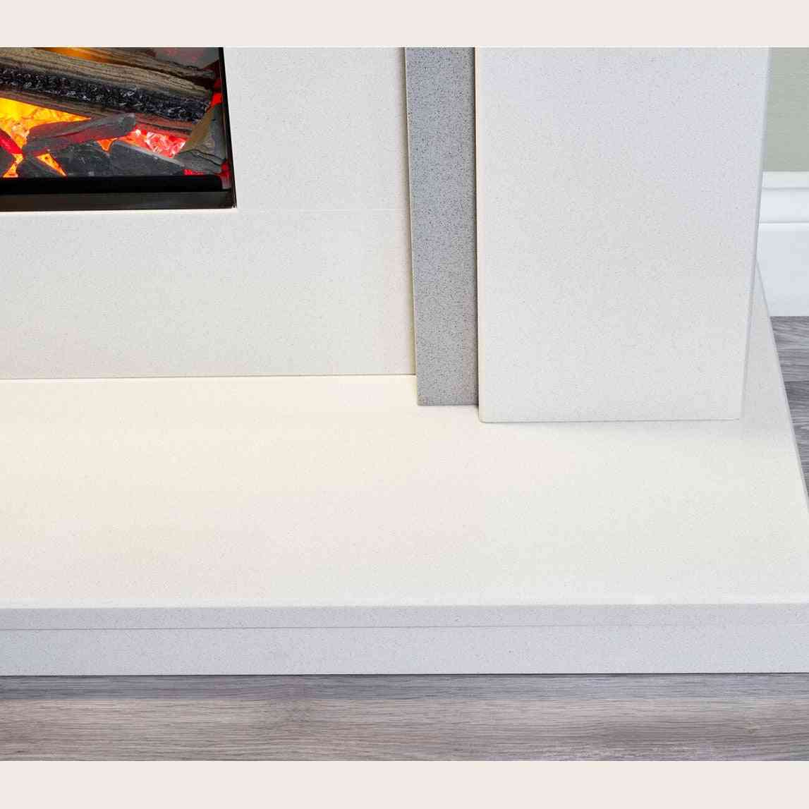 Close-up of white textured base and grey speckled side panel on Aurora marble electric fireplace suite