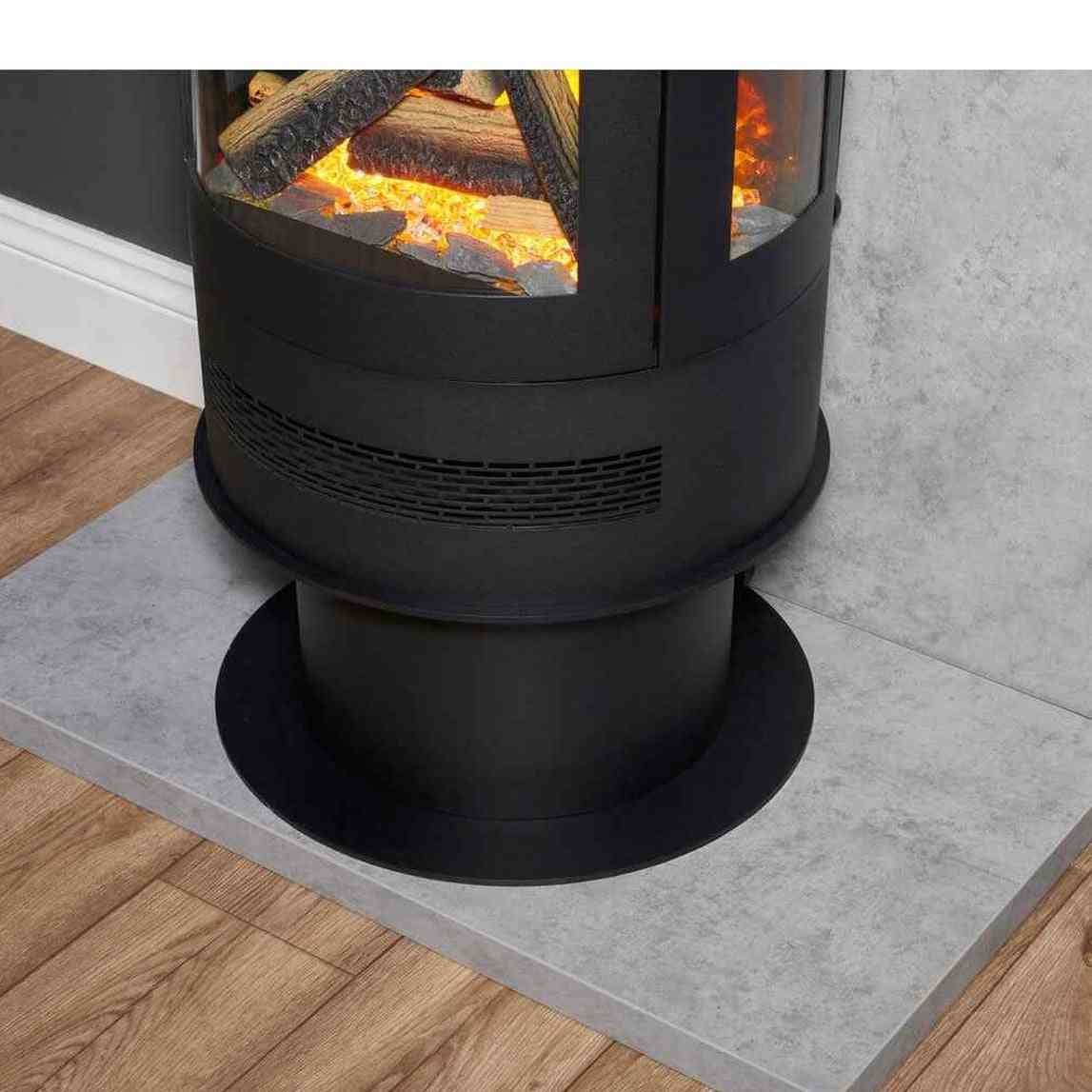 Close-up of black cylindrical stove base with matte finish horizontal vents and circular platform