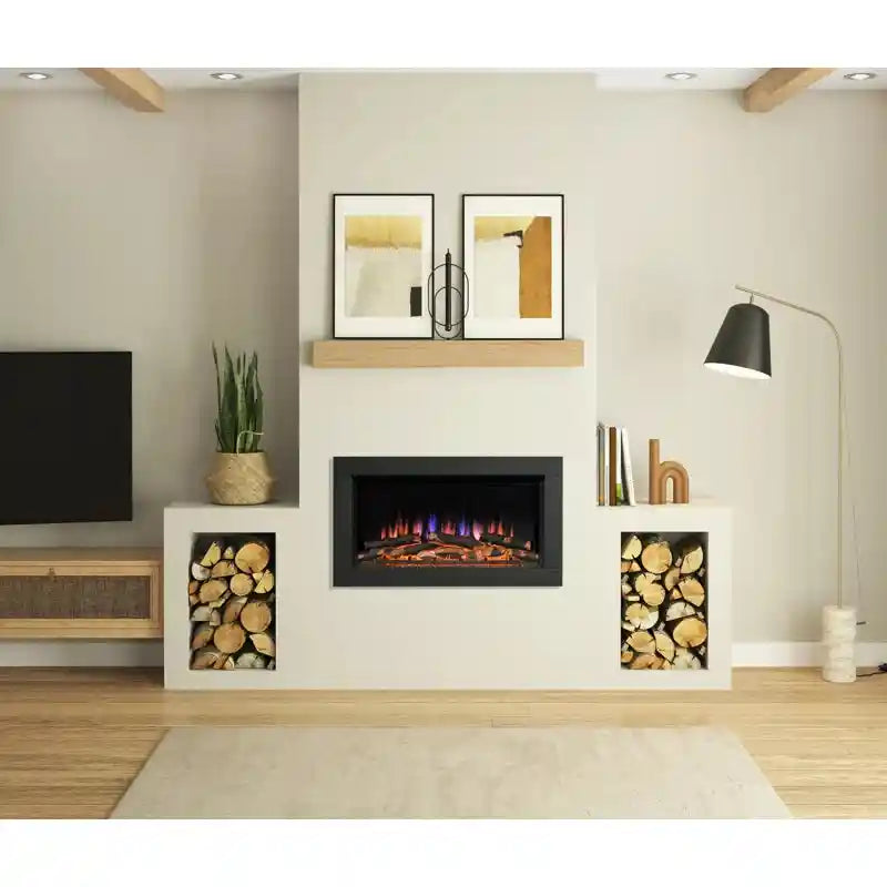 Modern living room with a sleek black inset electric fire surrounded by white built-in shelves filled with firewood, minimalist artwork, and a black floor lamp