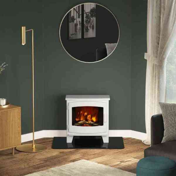 Cozy living room scene featuring white freestanding electric stove with fire effect
