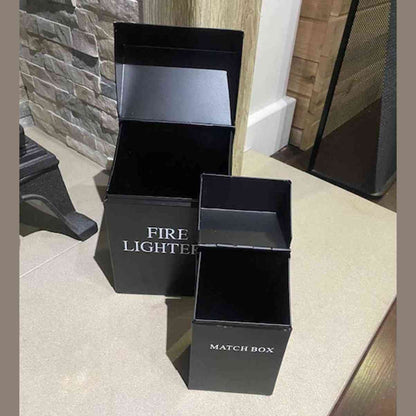 Black powder-coated steel fire lighter and match box holder set open on hearth