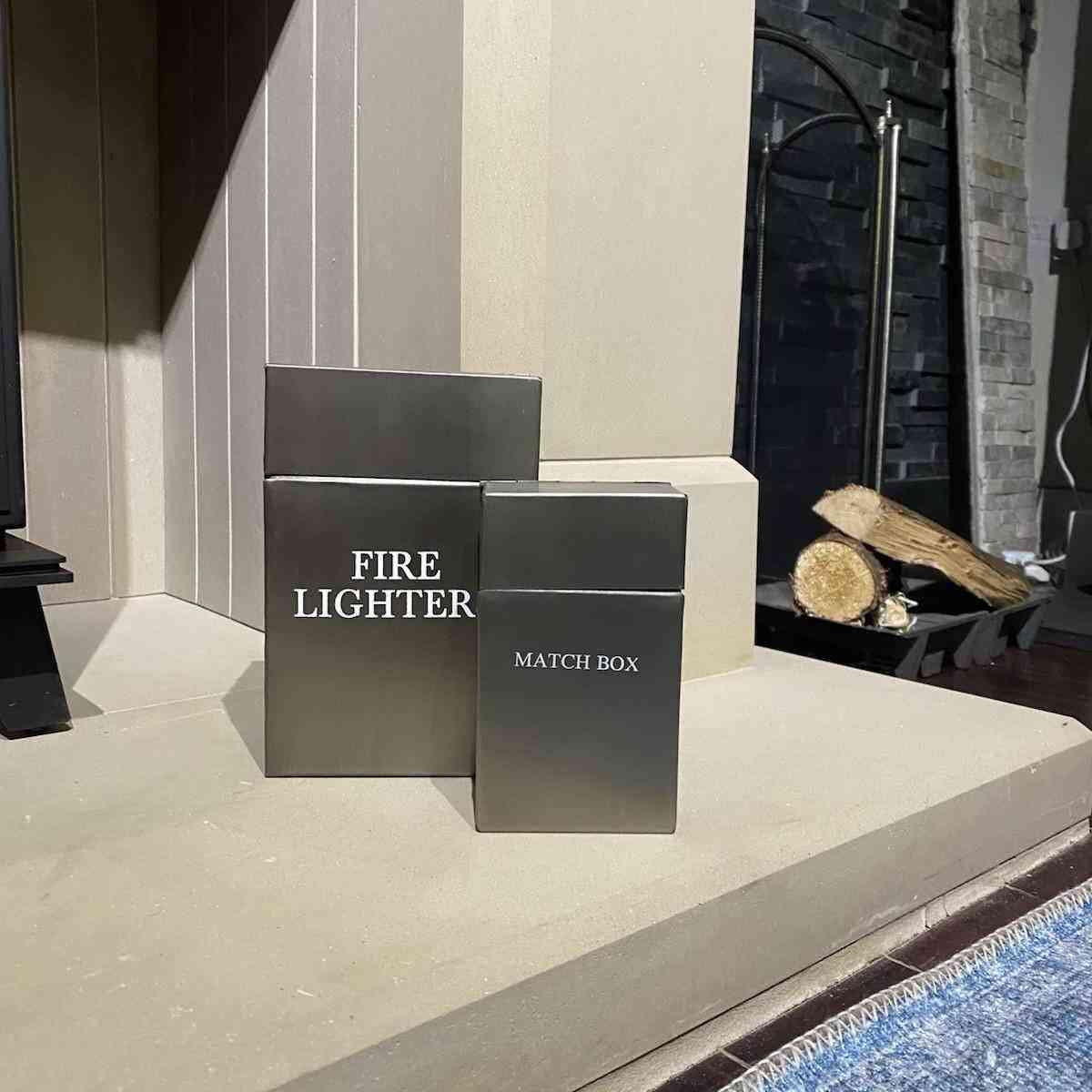 Two-piece brushed silver metal fireplace storage solution with hinged lids