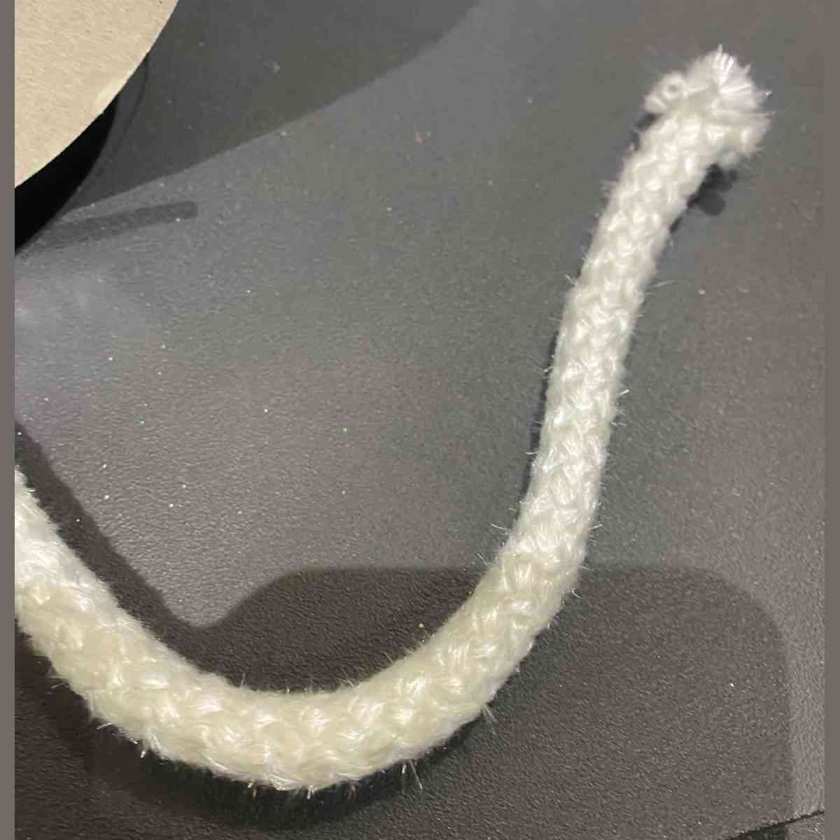 Close-up of textured white 10mm high-temperature stove door gasket rope