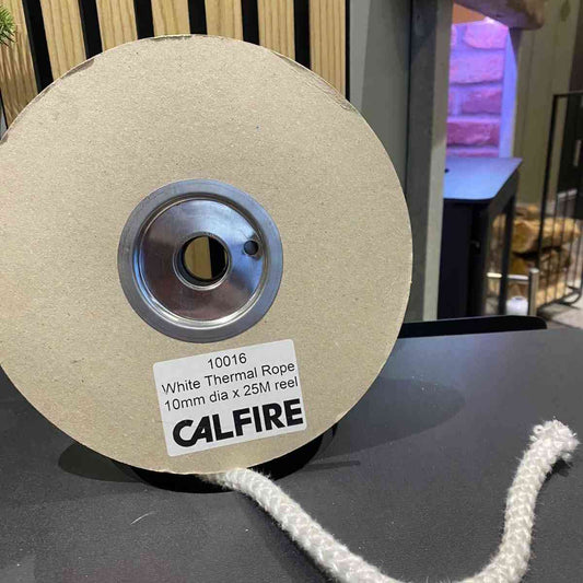 Unspooled Calfire 10mm white braided fireplace gasket rope on dark table