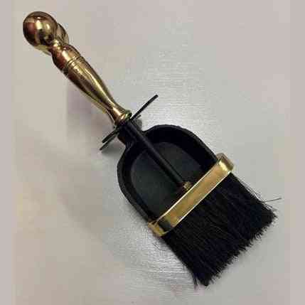 Close-up of Calfire cast iron fireplace shovel and bristle brush with spherical finial handle