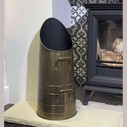 Calfire Dryton antique pewter coal scuttle on stone hearth with wood stove