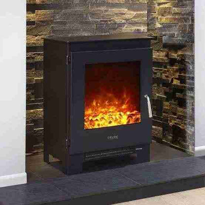Black Celsi Electriflame XD Metal 1 electric stove with realistic LED flame effect against stacked stone wall