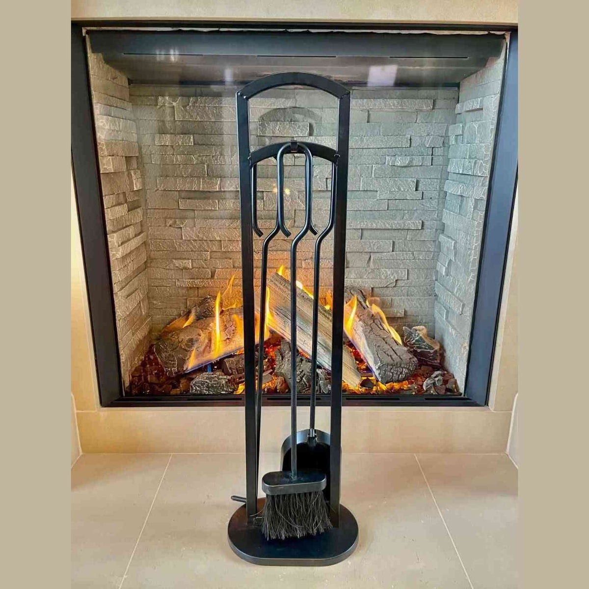 Heavy-duty matte black fireplace companion set with arched stand