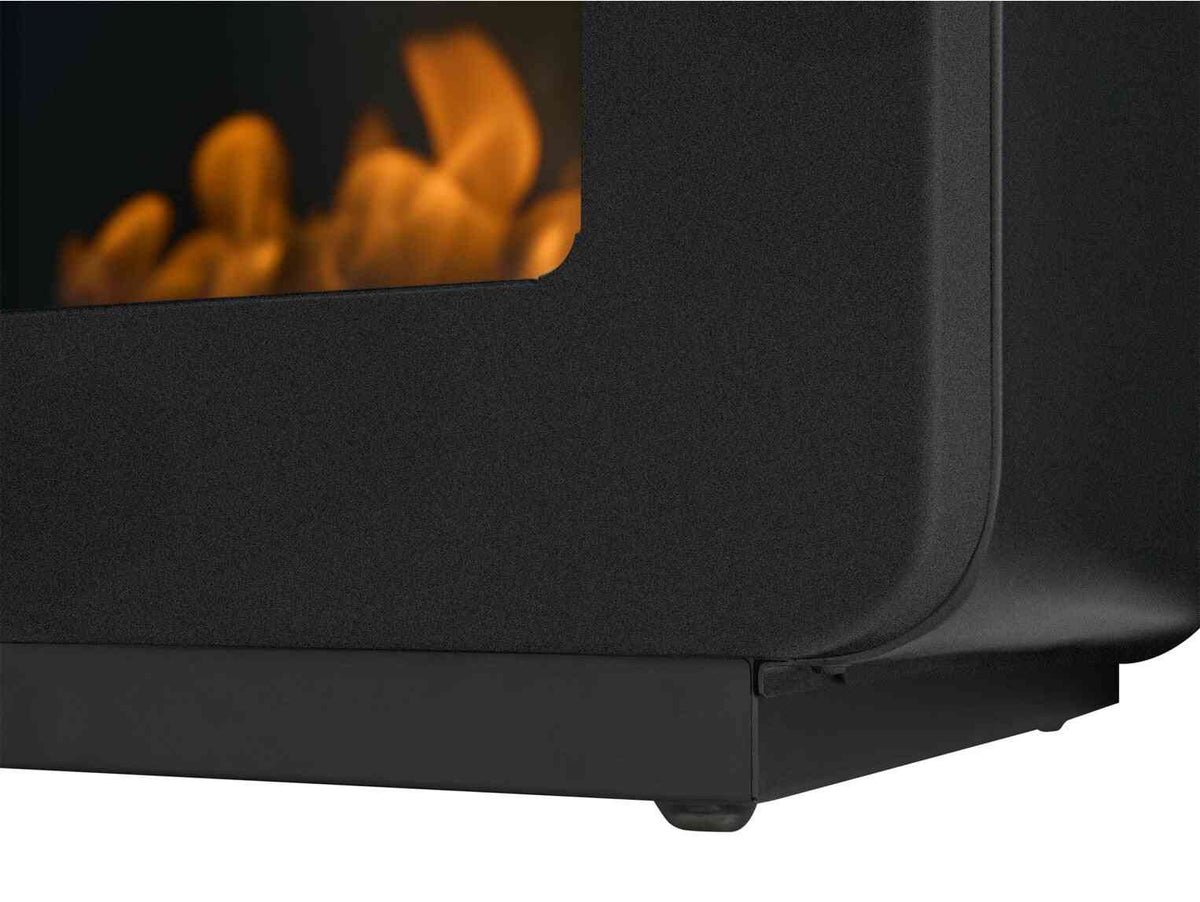 Close-up of a black electric fireplace or stove base with a glowing orange flame effect visible through the front glass.