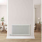 White Eden Arcadia WiFi electric column radiator installed in hallway with rustic decor