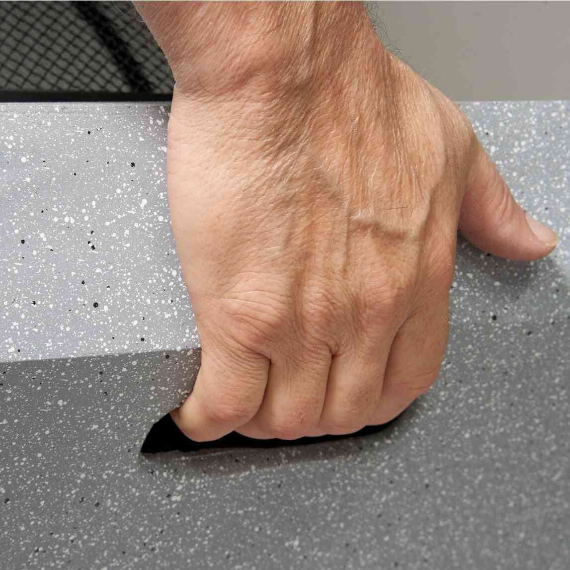 Grey speckled concrete fire pit with integrated carry handle detail