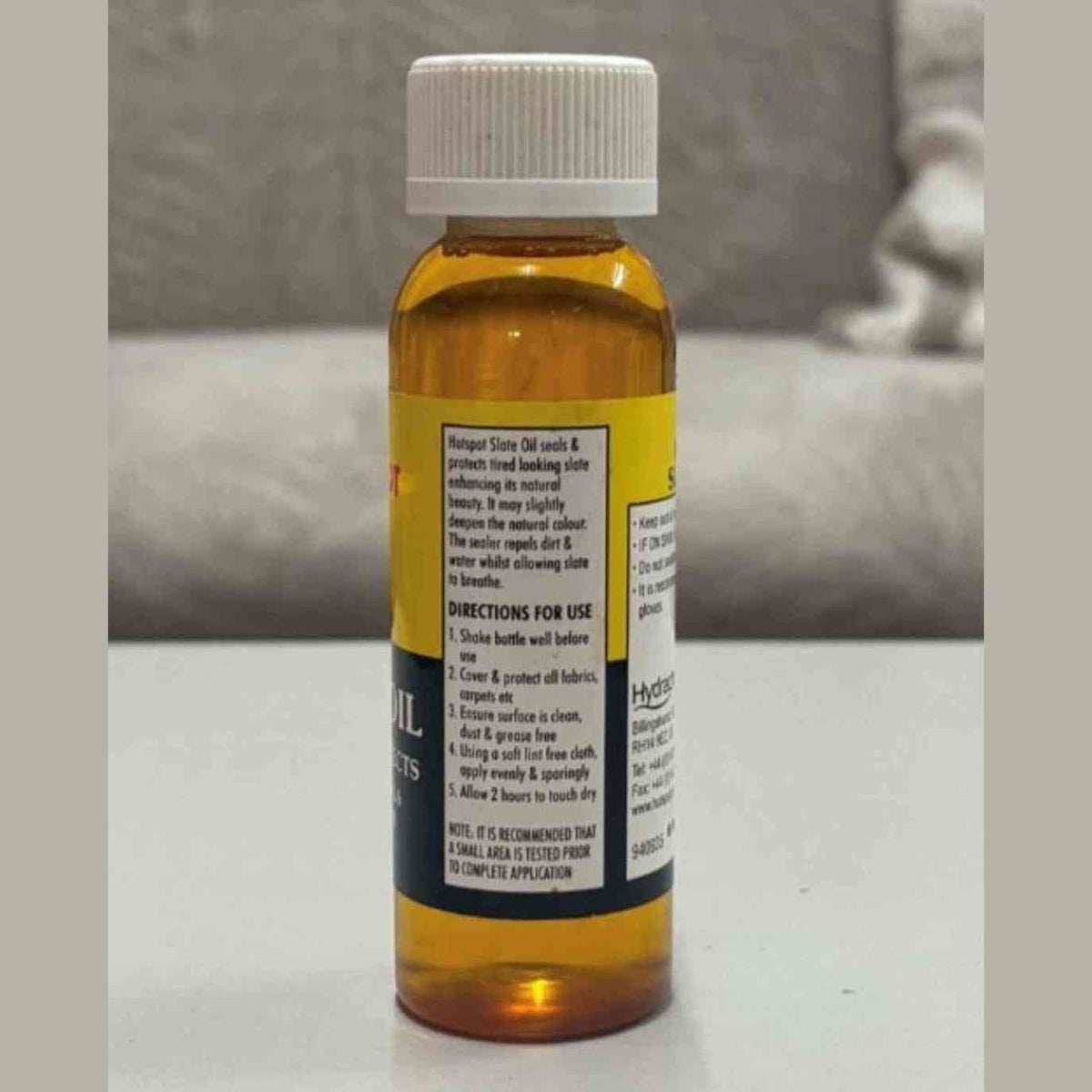Hotspot Slate Oil 100ml side view showing amber bottle with directions for use