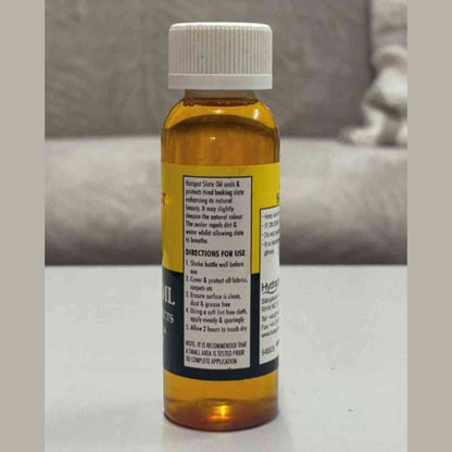Hotspot Slate Oil 100ml side view showing amber bottle with directions for use