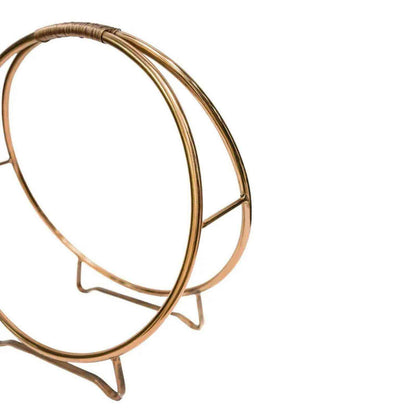 Side view of copper double-ring log holder with three-pronged base