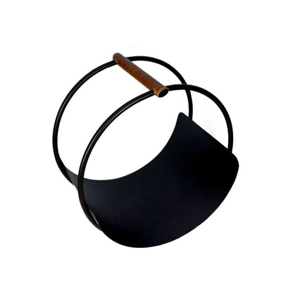 Empty Ivyline matte black iron log holder with curved leather handles on white background