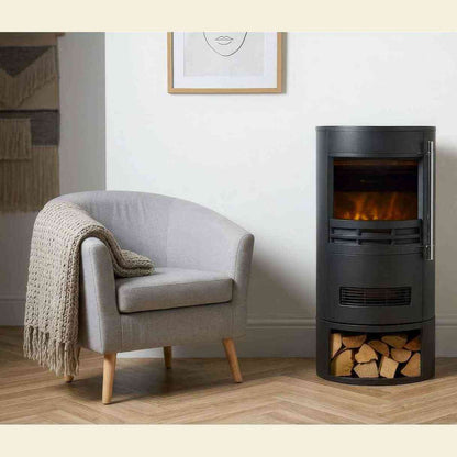 Black cylindrical electric fireplace in modern living room with lit LED flame
