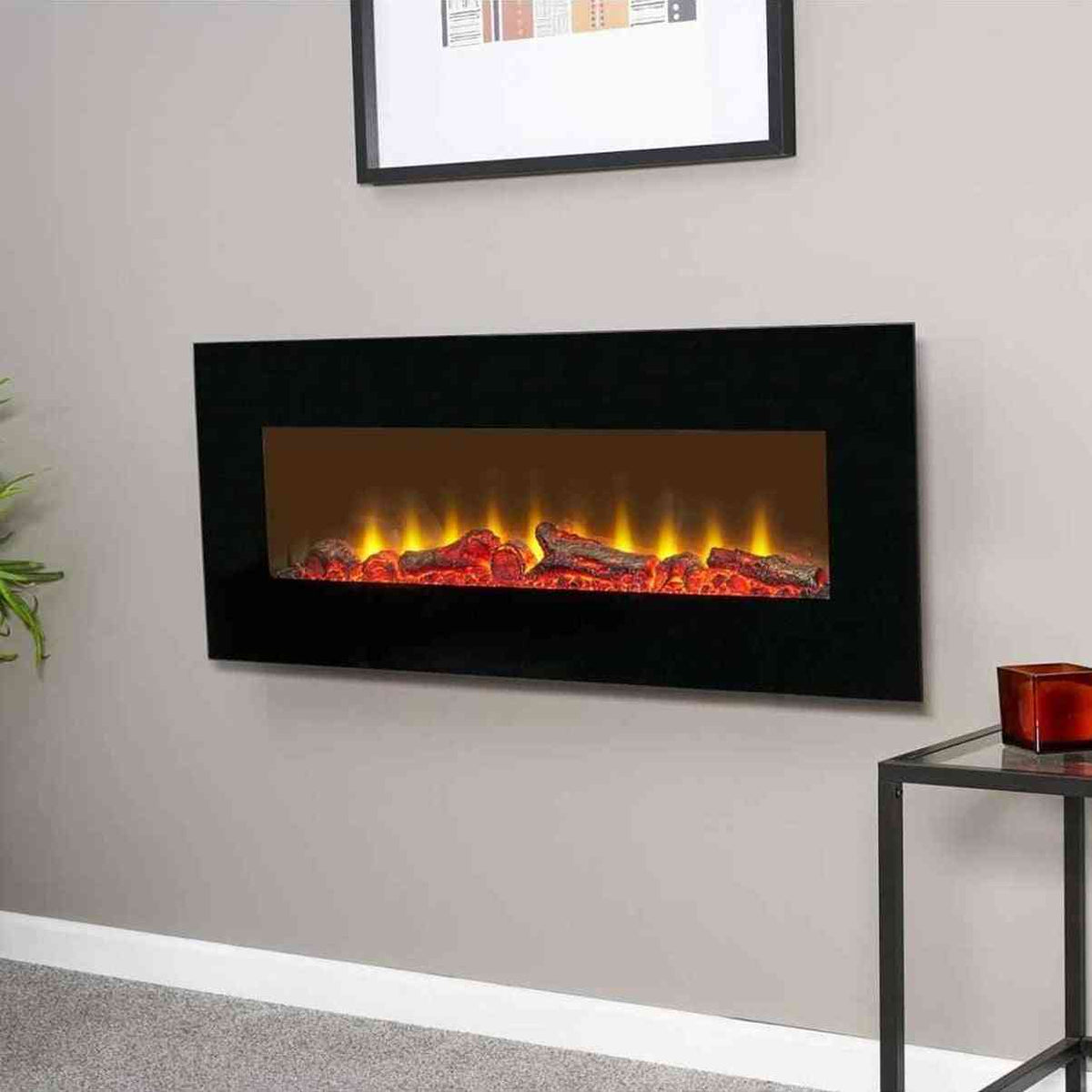 Sureflame black electric fireplace installed on gray wall with active LED flame effect