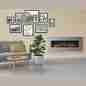 Living room with modern decor, featuring a sleek wall-mounted electric fireplace with wooden flooring and minimalist design.