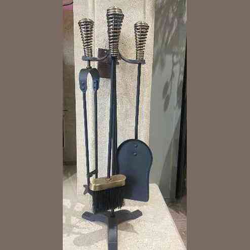Full view of black cast iron fireside companion set with coiled brass handles and shovel