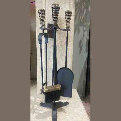 Full view of black cast iron fireside companion set with coiled brass handles and shovel