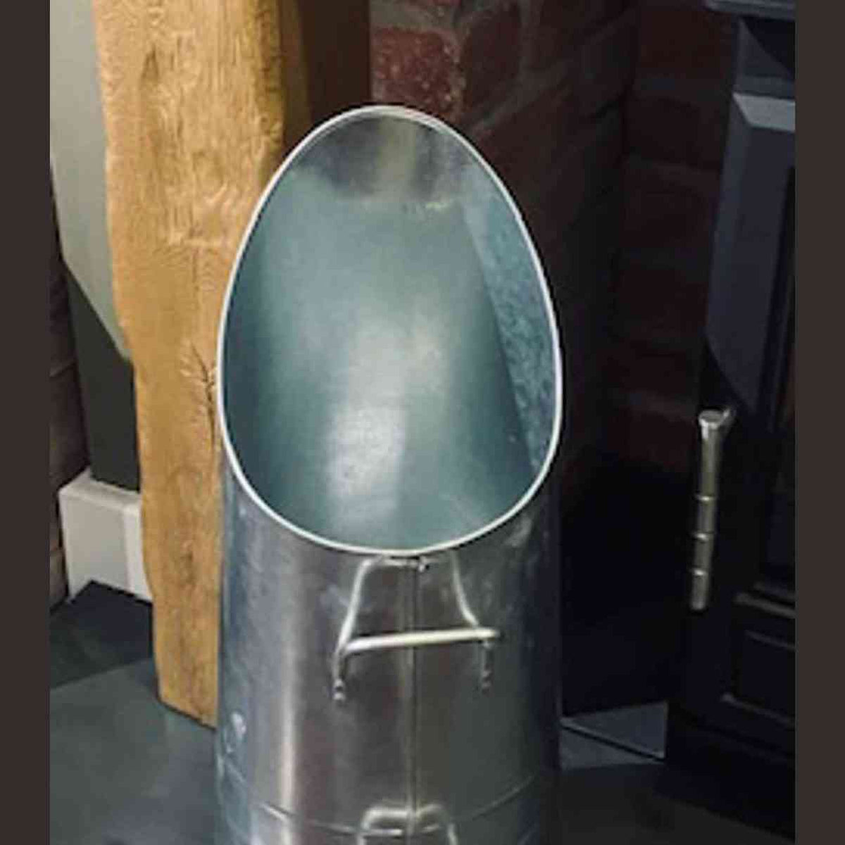 Traditional zinc coal hod with flared oval opening and side handles