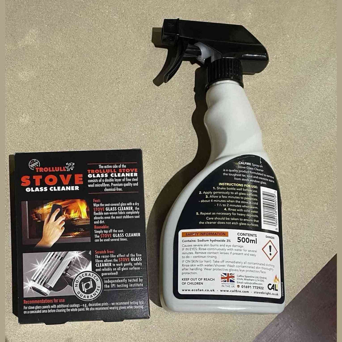 Calfire spray-on stove glass cleaner bottle with black trigger nozzle and soot remover label