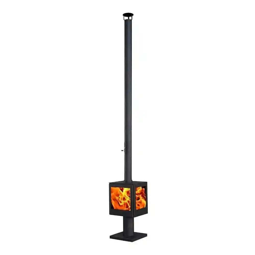Black outdoor wood burning stove with lit flames and chimney cap visible