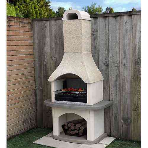 Woodford Verona masonry barbecue with beige limestone finish, black cast cement flue and log storage
