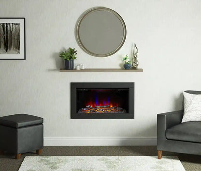 Modern living room with a black inset electric fireplace displaying colorful flames, surrounded by light-colored walls and minimalist decor