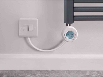 White electrical outlet with two switches and a connected smart digital thermostat displaying 30.0°C, mounted on a light gray wall