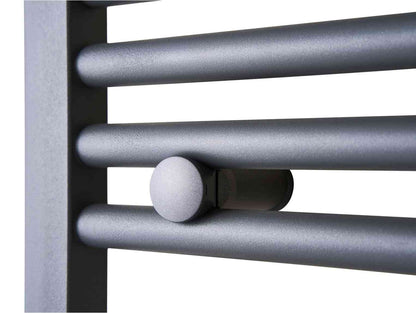 Close-up of a modern, silver-colored electric towel radiator with horizontal bars and a rounded control knob, designed for bathroom heating.